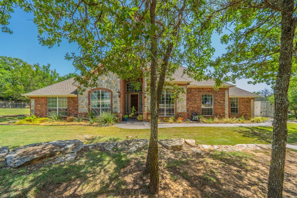 109 Overton Ridge Circle Weatherford, TX 76088 - Photo 1 of 27 Beautiful one story home- Stone & Brick exteriior.