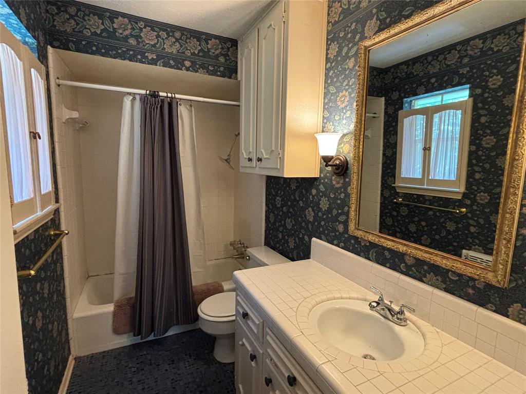 328 Ridge Crest Drive Richardson, TX 75080 - Photo 13 of 17 a bathroom with a sink toilet and shower