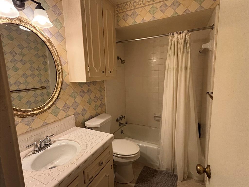 328 Ridge Crest Drive Richardson, TX 75080 - Photo 16 of 17 a bathroom with a sink a toilet and shower