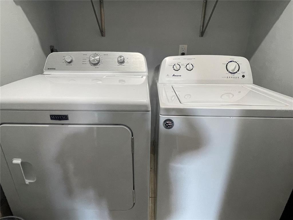 5754 Southwest 8th Place Gainesville, FL 32607 - Photo 25 of 29 a utility room with dryer and washer