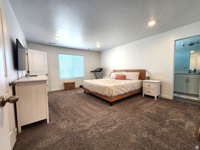1736 East Fall Street Eagle Mountain, UT 84005 - Photo 9 of 30 Bedroom featuring dark carpet and ensuite bath