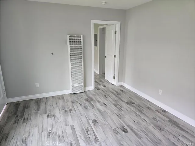a view of wooden floor in an empty room