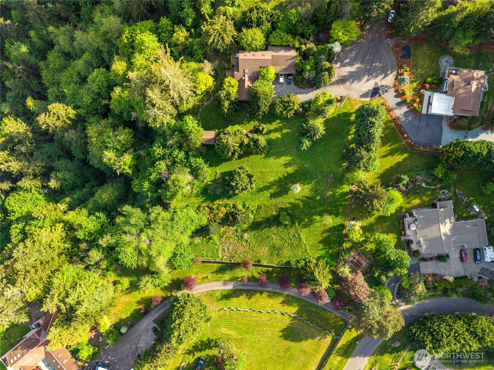 23421 Rim Road Graham, WA 98338 - Photo 14 of 21 an aerial view of residential house with swimming pool and outdoor space