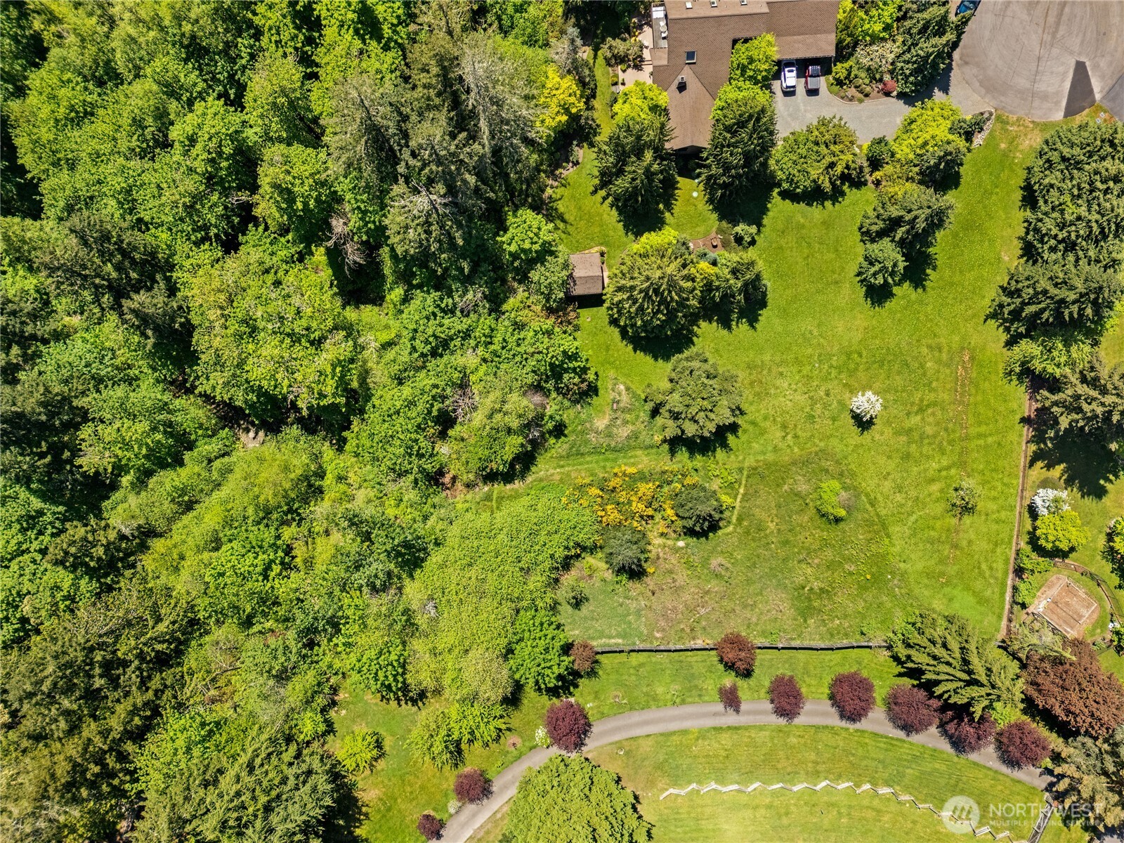 23421 Rim Road Graham, WA 98338 - Photo 20 of 21 a view of a garden with a fountain