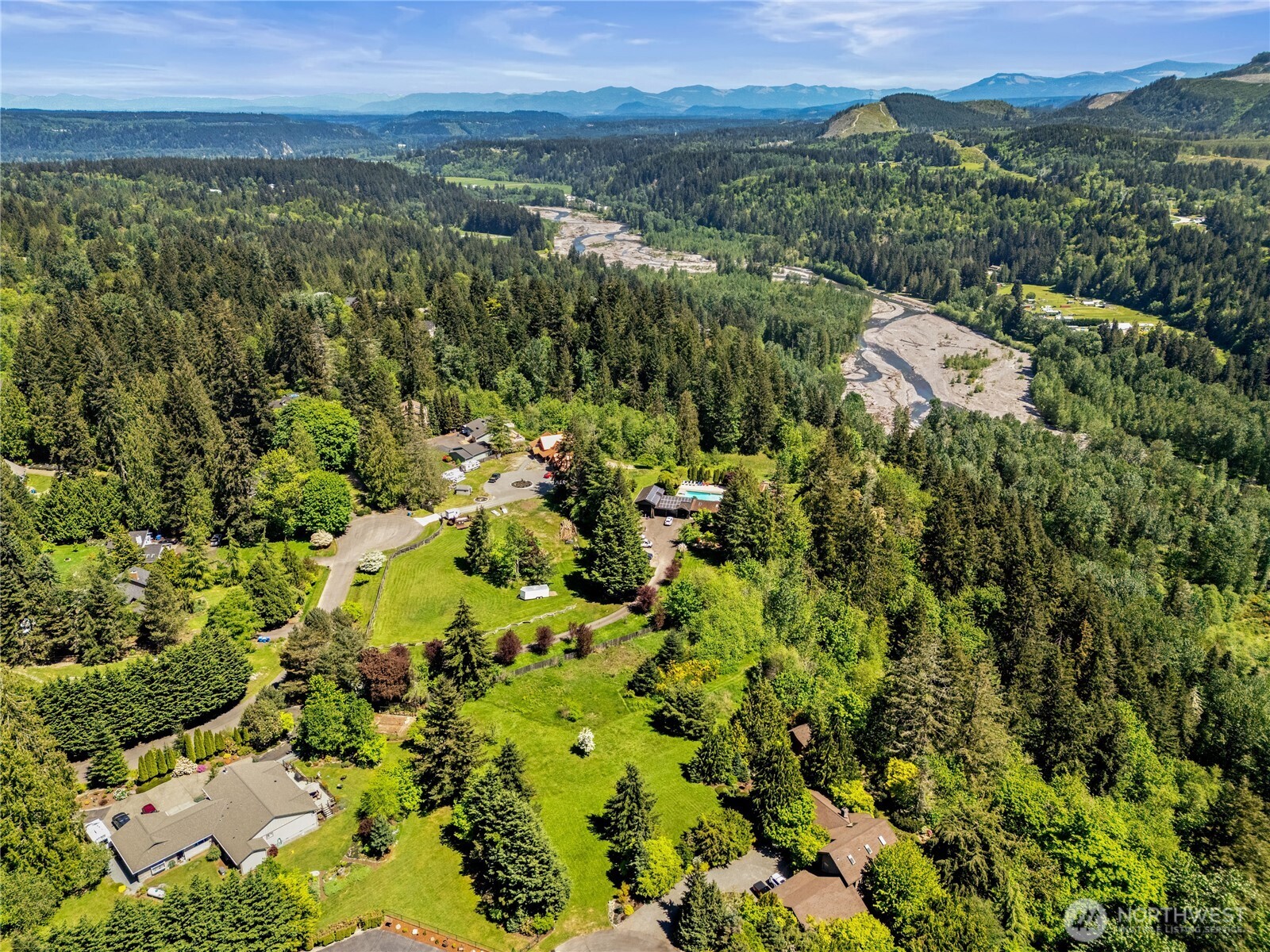 23421 Rim Road Graham, WA 98338 - Photo 5 of 21 an aerial view of a city with lots of residential buildings
