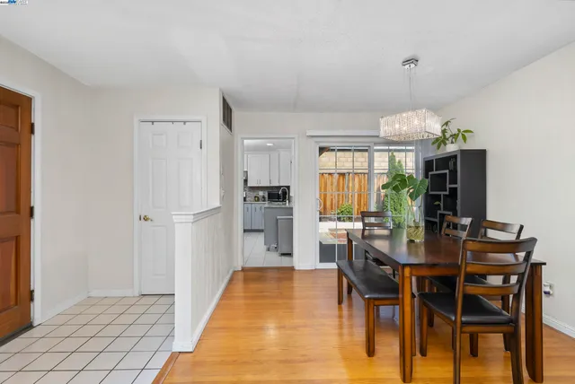 a kitchen with granite countertop stainless steel appliances and refrigerator