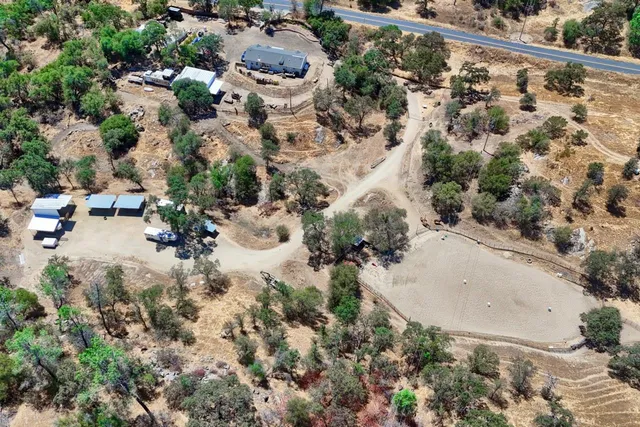 an aerial view of residential house with outdoor space
