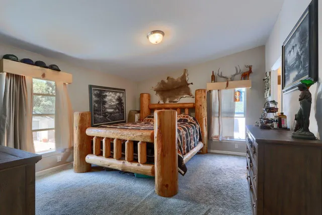 a view of an bedroom with furniture and a window
