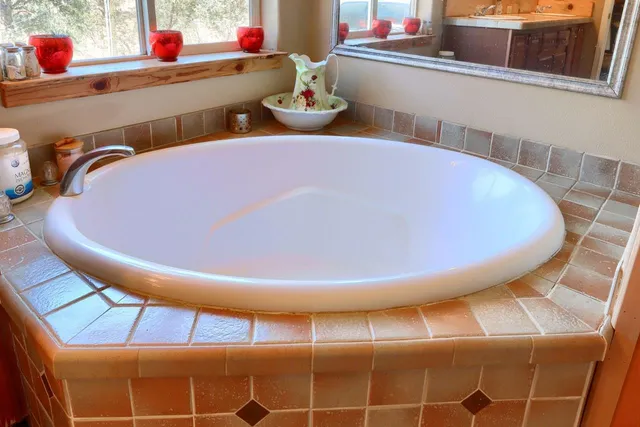 a front view of a house with sitting area