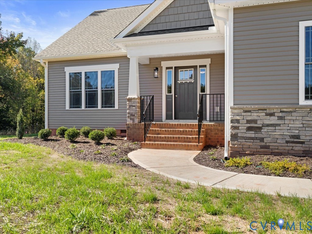 2021 Ridge Road Powhatan, VA 23139 - Photo 2 of 44 a front view of a house with a yard
