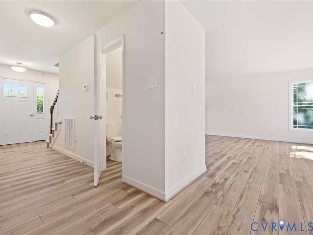 2021 Ridge Road Powhatan, VA 23139 - Photo 24 of 44 a view of a hallway with wooden floor