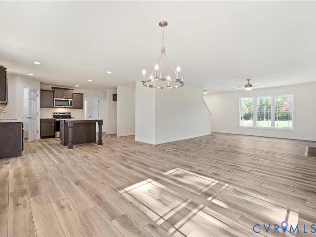 2021 Ridge Road Powhatan, VA 23139 - Photo 10 of 44 a view of a kitchen with a stove cabinets and a chandelier