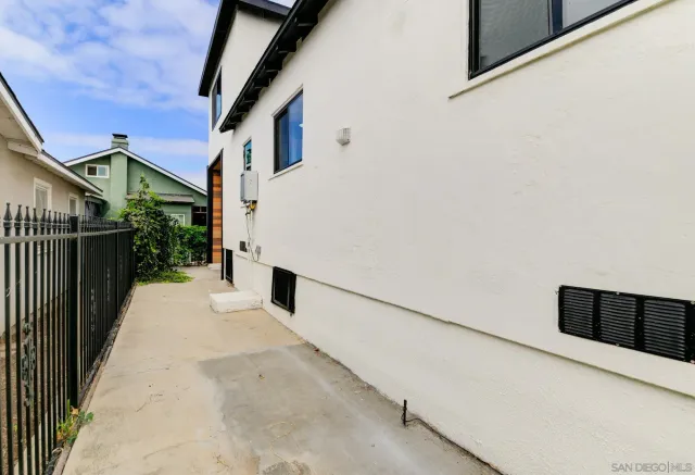 a view of a street with a building in the background