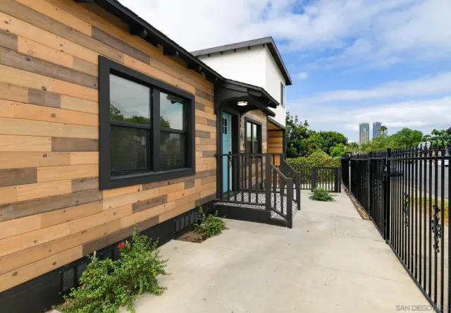 a view of a house with a small yard