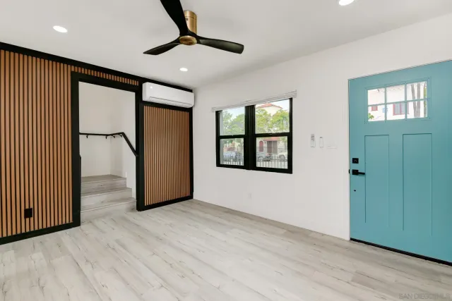 wooden floor in an empty room with a window