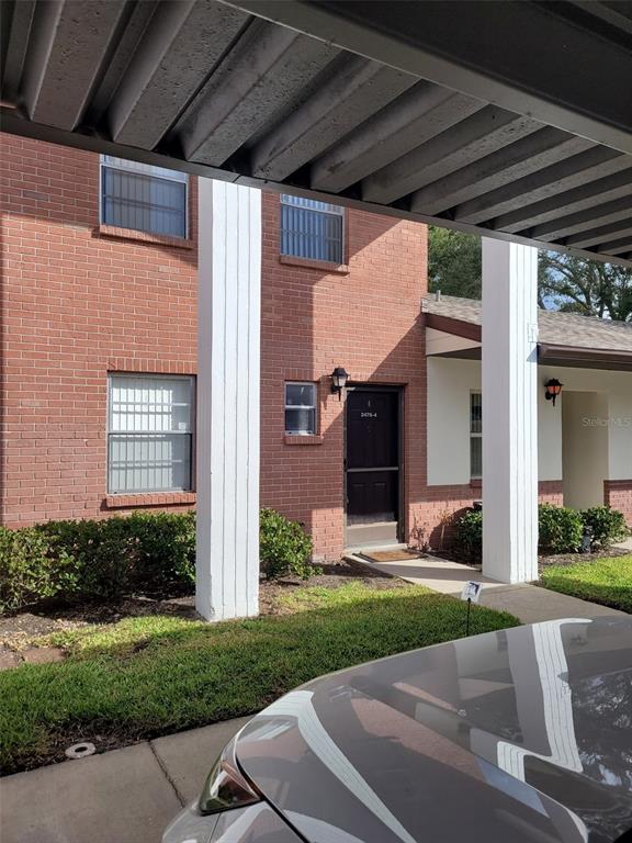 2478 Enterprise Road, Unit 4 Clearwater, FL 33763 - Photo 1 of 1 a front view of a house with a yard
