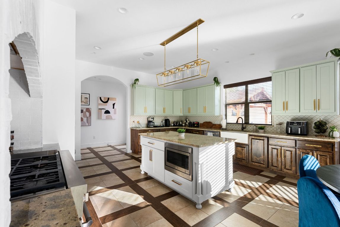 1116 Terjo Lane Austin, TX 78732 - Photo 11 of 40 a kitchen with sink stove and cabinets