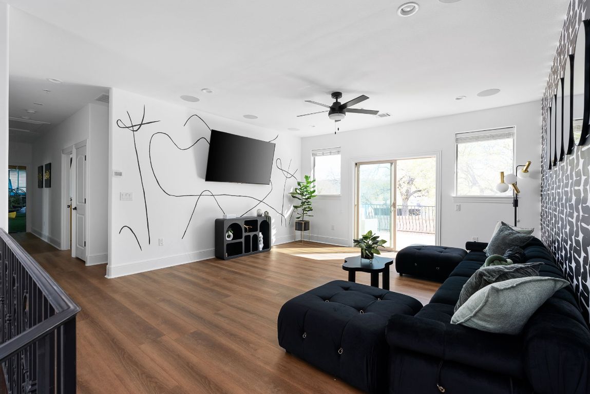 1116 Terjo Lane Austin, TX 78732 - Photo 20 of 40 a living room with furniture a fireplace and a flat screen tv