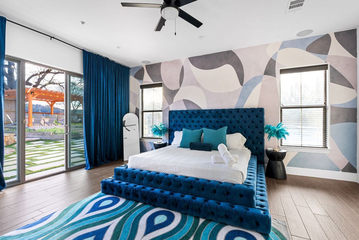 1116 Terjo Lane Austin, TX 78732 - Photo 28 of 40 a bedroom with a large bed and a large window