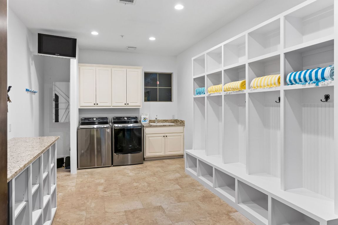 1116 Terjo Lane Austin, TX 78732 - Photo 33 of 40 a kitchen with stainless steel appliances a refrigerator and a stove top oven
