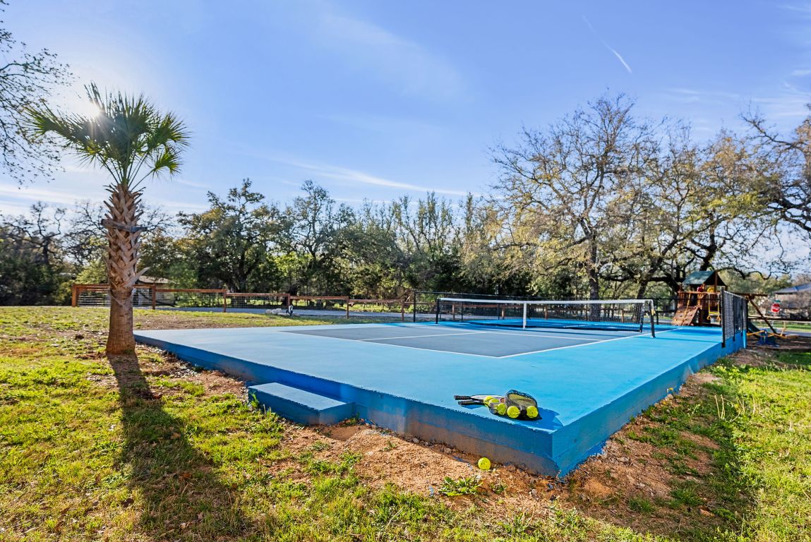 1116 Terjo Lane Austin, TX 78732 - Photo 35 of 40 a view of a swimming pool with an outdoor seating and yard