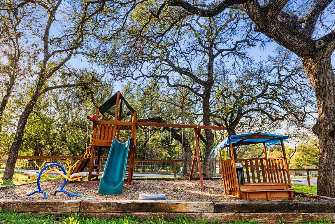 1116 Terjo Lane Austin, TX 78732 - Photo 36 of 40 a front view of a house with lots of trees