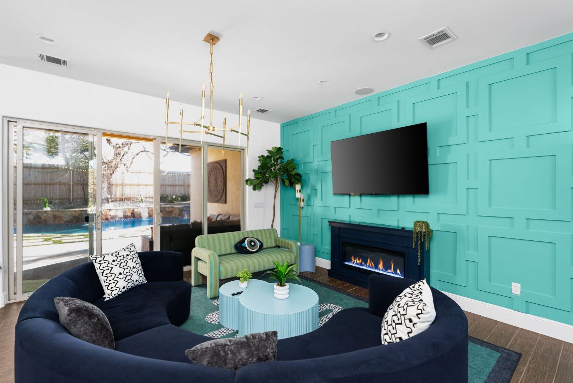 1116 Terjo Lane Austin, TX 78732 - Photo 9 of 40 a living room with fireplace furniture and a flat screen tv