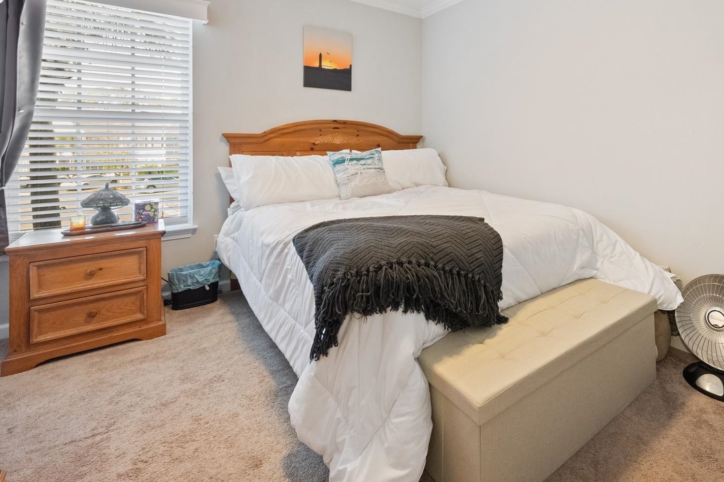 4665 Fringetree Drive, Unit 5E Murrells Inlet, SC 29576 - Photo 15 of 22 Bedroom with light colored carpet and ornamental molding