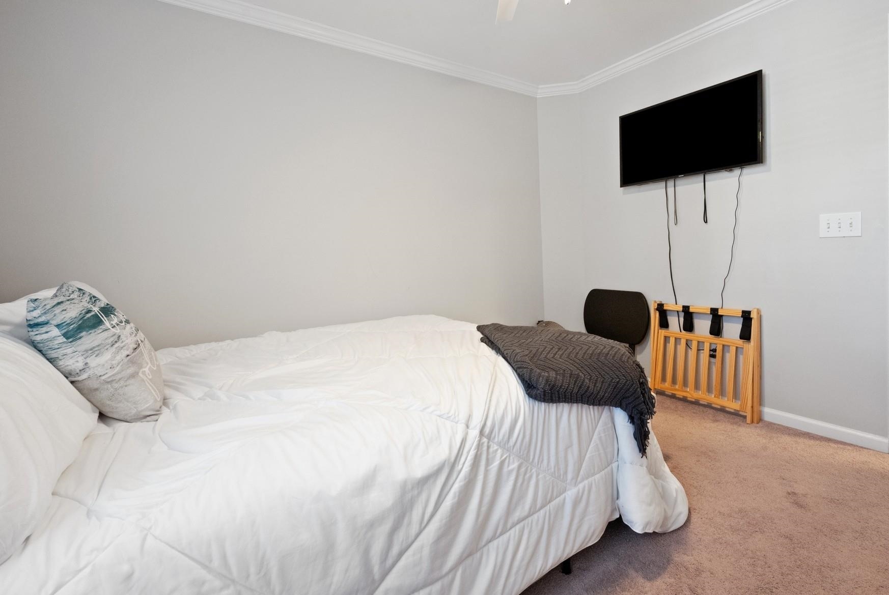 4665 Fringetree Drive, Unit 5E Murrells Inlet, SC 29576 - Photo 16 of 22 Carpeted bedroom with crown molding and ceiling fan