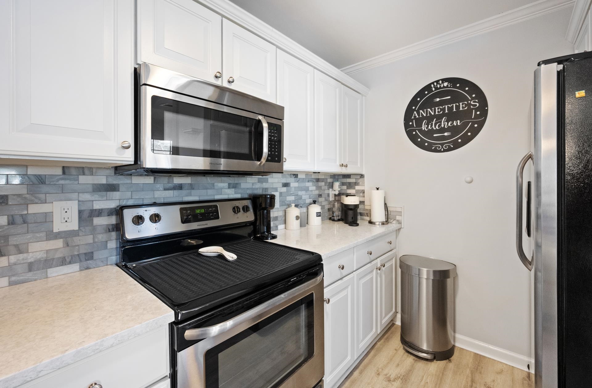 4665 Fringetree Drive, Unit 5E Murrells Inlet, SC 29576 - Photo 7 of 22 Kitchen with stainless steel appliances and quartz countertops
