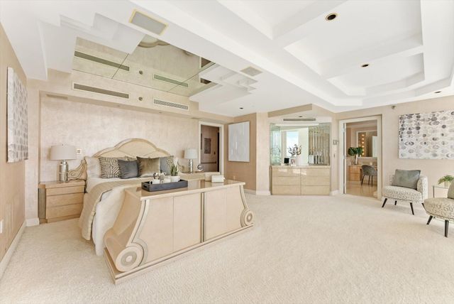 a view of a kitchen with furniture and chandelier