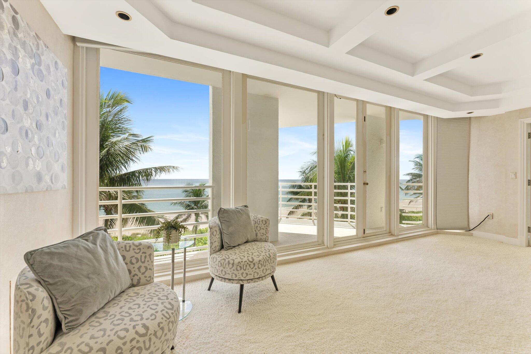 800 South Ocean Boulevard, Unit 303 Boca Raton, FL 33432 - Photo 22 of 49 a living room with furniture and a large window