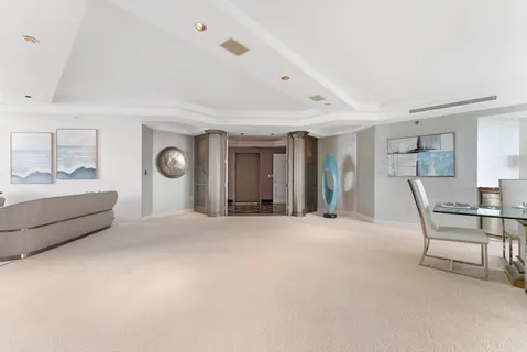 a view of a livingroom with furniture and windows