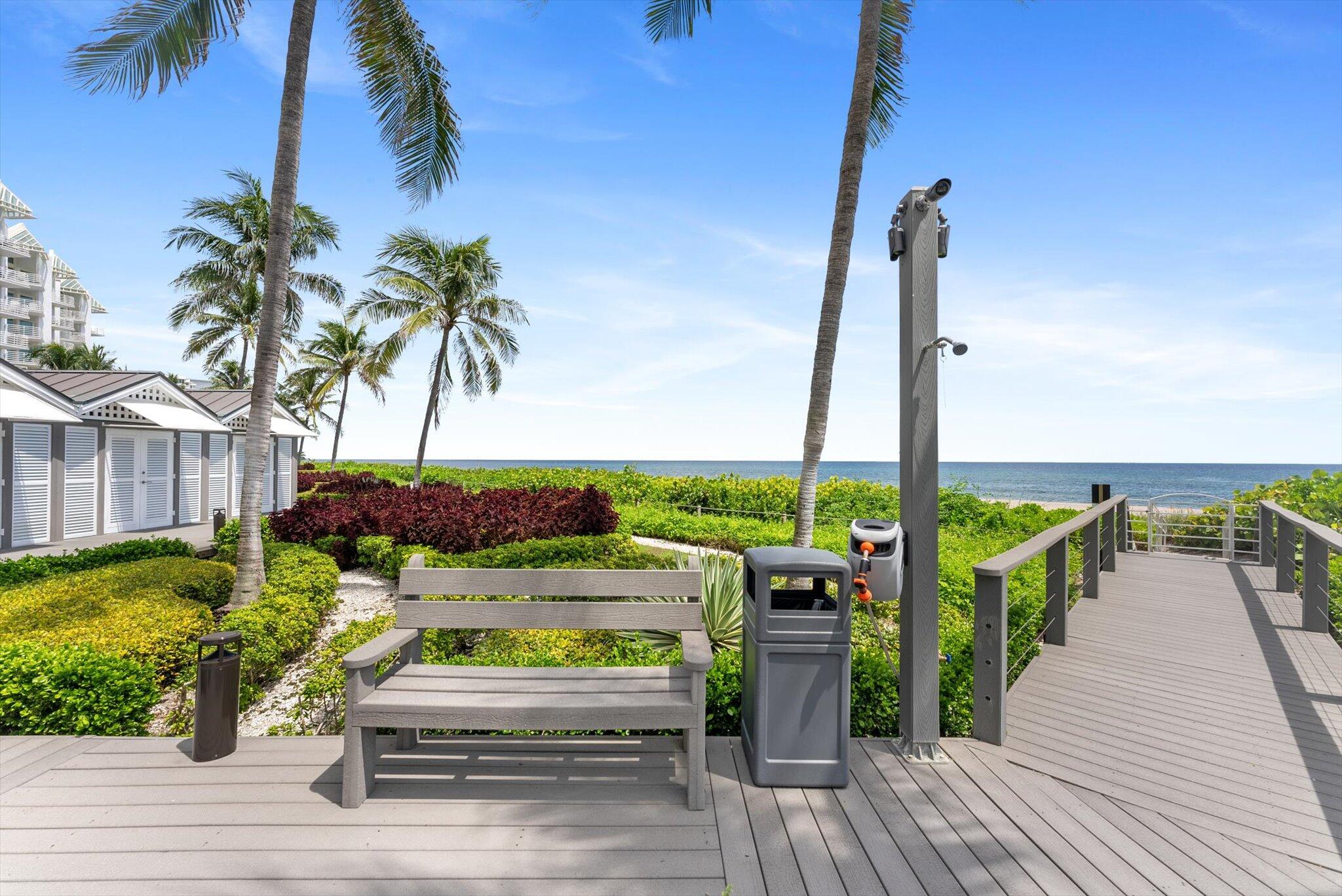 800 South Ocean Boulevard, Unit 303 Boca Raton, FL 33432 - Photo 31 of 49 a view of a wooden deck with a table and chairs