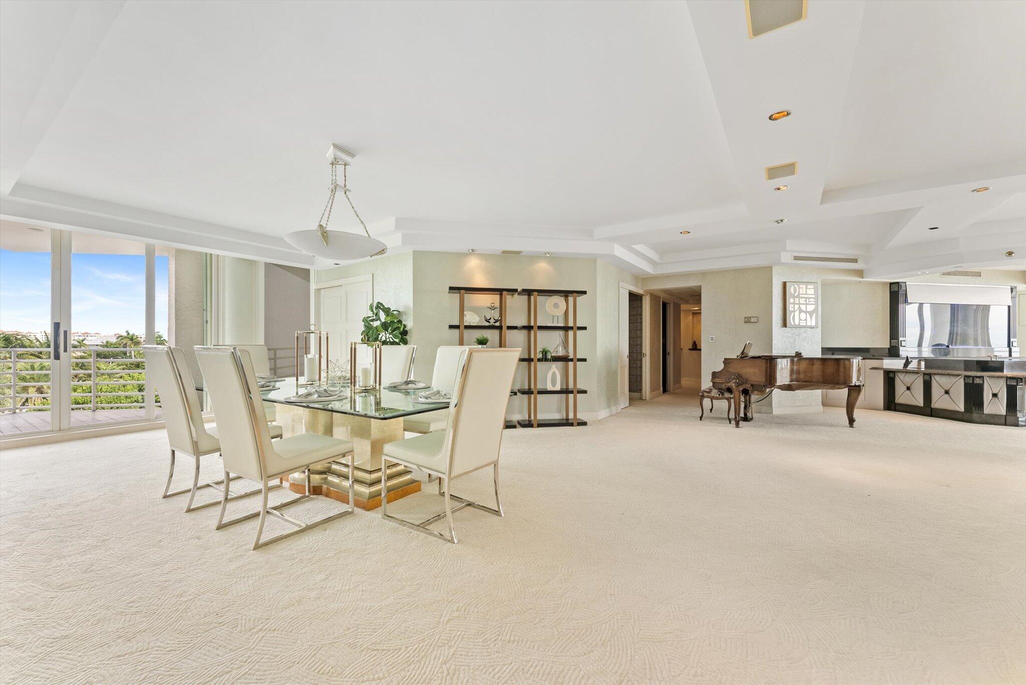 800 South Ocean Boulevard, Unit 303 Boca Raton, FL 33432 - Photo 5 of 49 a view of a livingroom with furniture and a floor to ceiling window