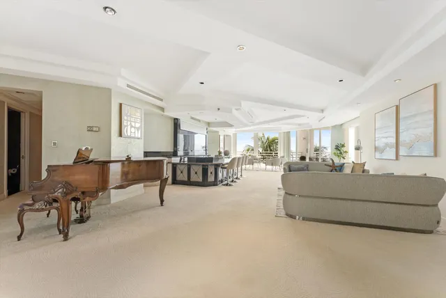 a living room with furniture and a table