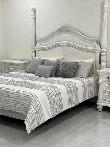 a bathroom with a bathtub sink and mirror