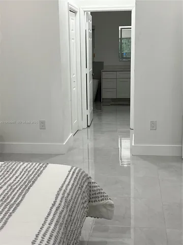 a view of a swimming pool with a patio and a yard