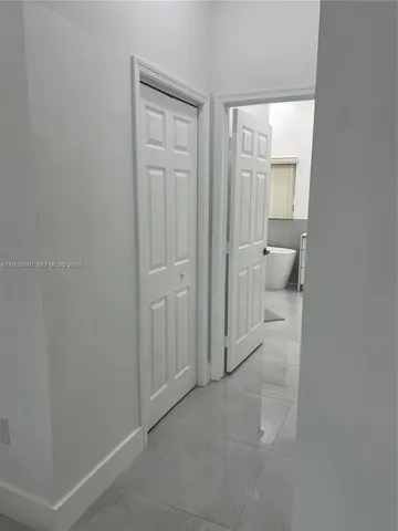 a view of a swimming pool with a yard and sitting area