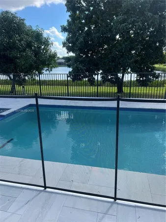a view of swimming pool with deck