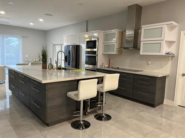 a kitchen with a sink cabinets and window