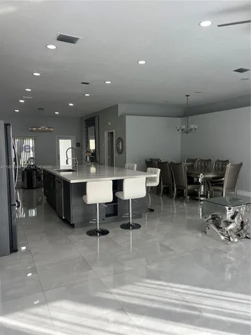 a kitchen with a sink and a stove