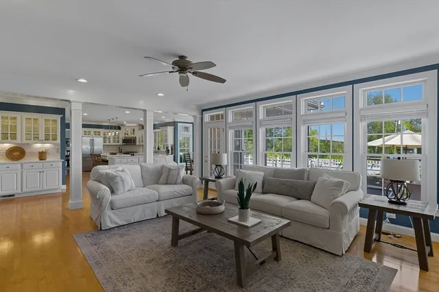 a living room with furniture a rug and a flat screen tv