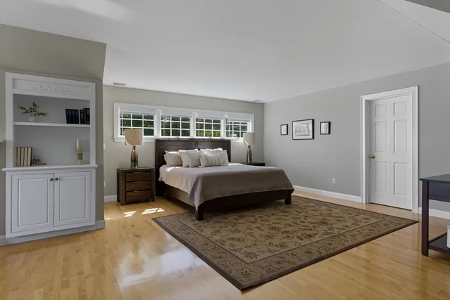 a bathroom with a granite countertop sink mirror vanity and a toilet
