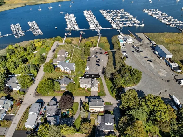 a kitchen with stainless steel appliances granite countertop a stove a sink a stove a dining table and chairs