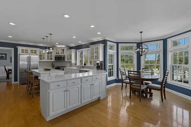 a kitchen with a stove a sink and a refrigerator