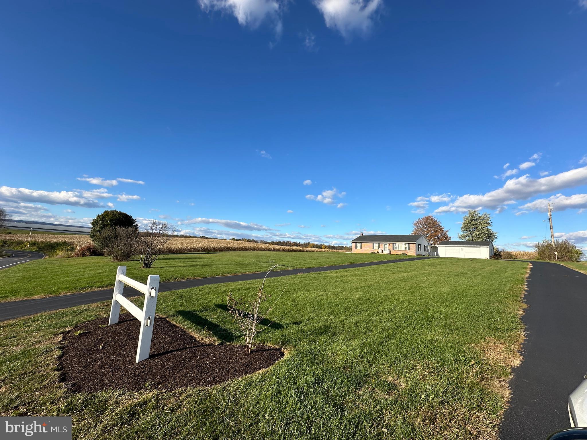 236 Bullshead Road Newville, PA 17241 - Photo 32 of 140 a view of a bench in the garden near a lake