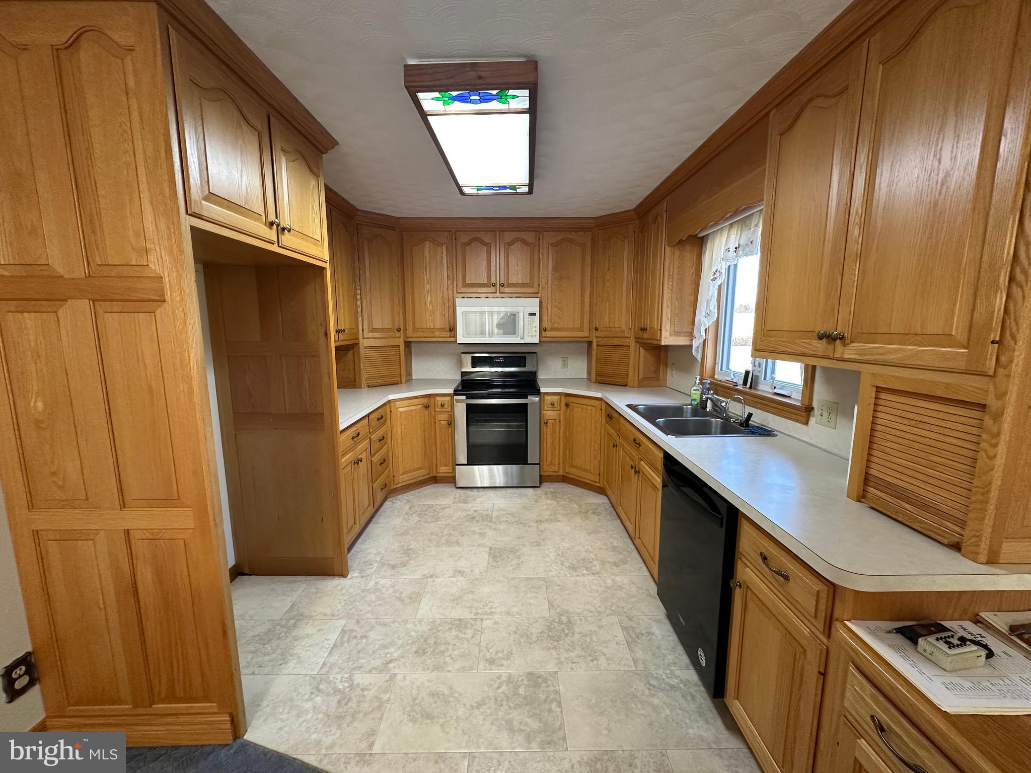 236 Bullshead Road Newville, PA 17241 - Photo 70 of 140 a large kitchen with stainless steel appliances granite countertop a stove refrigerator sink and dishwasher