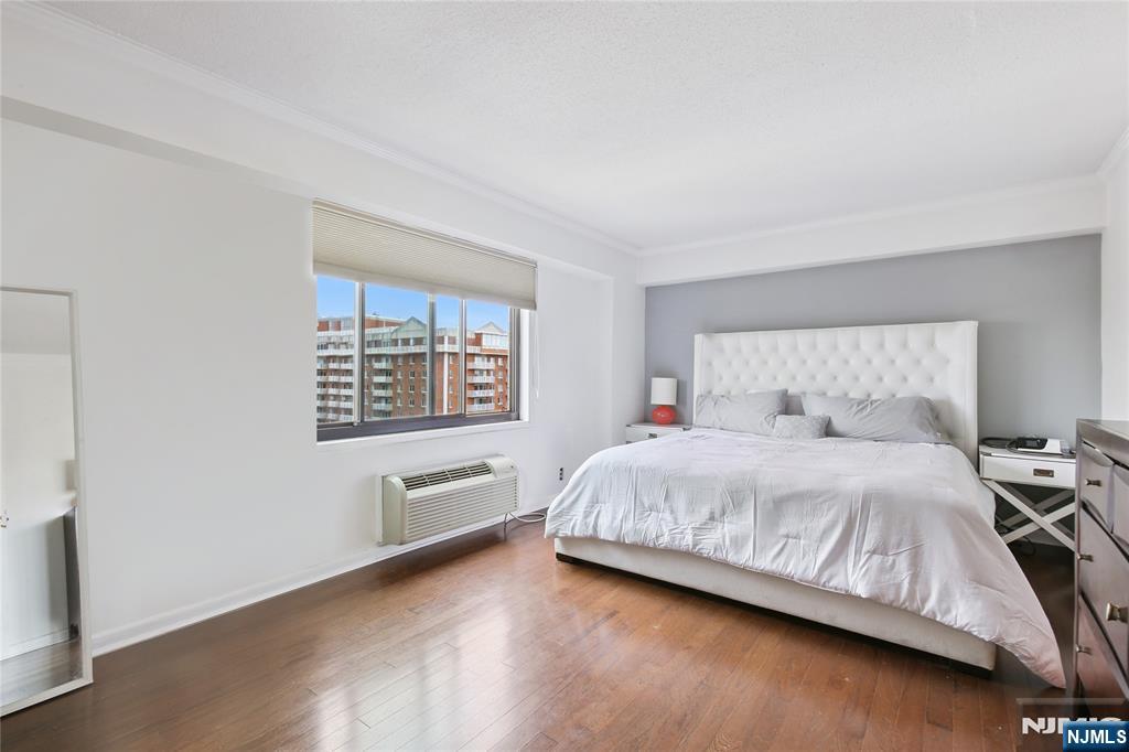 125 Prospect Avenue, Unit 17G Hackensack, NJ 07601 - Photo 15 of 20 a bedroom with a bed and window
