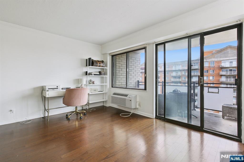 125 Prospect Avenue, Unit 17G Hackensack, NJ 07601 - Photo 10 of 20 a workspace with furniture window and a kitchen space